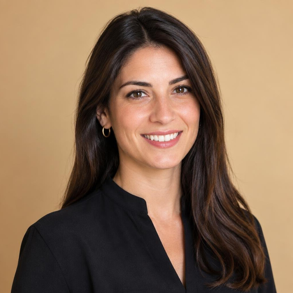 Professional headshot of an Italian woman camera planning lead