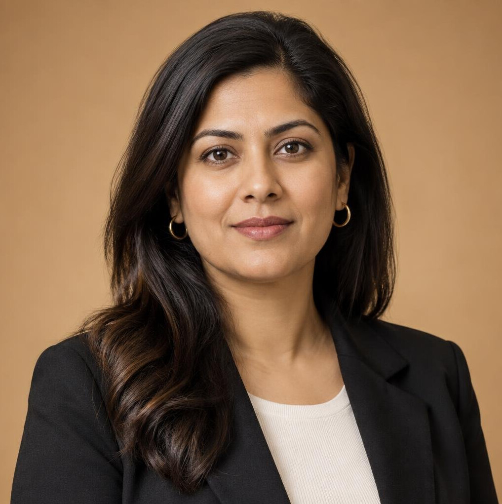Professional headshot of a South Asian woman studio production lead