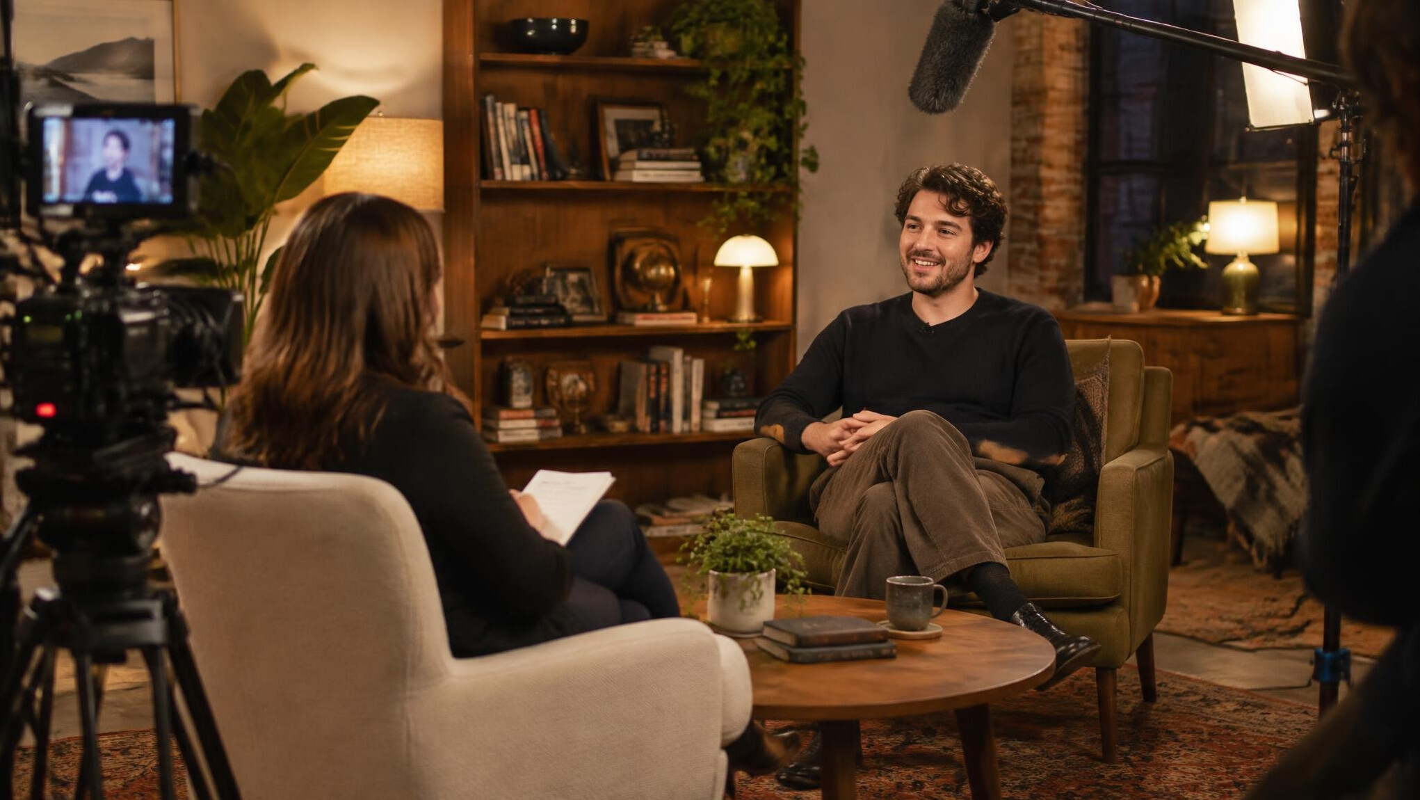 Behind the scenes of an entertainment interview shoot with warm lighting